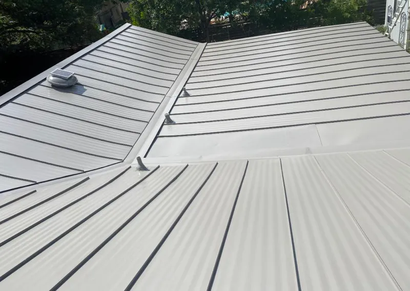 Solar attic fan installed on a metal roof for Roof Ventilation in New Philadelphia